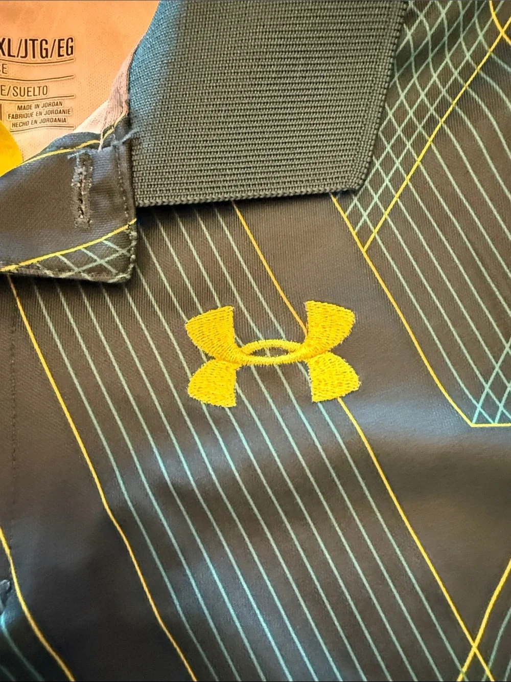 Under Armour Boys Black Polo with Yellow Logo and Teal Geometric Lines